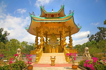 Naklejka premium Pagoda with seated Buddha, which is part of a large Buddhist temple complex, Phu My, Vietnam.