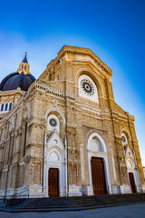 Cathedral of San Pietro Apostolo, also known as Duomo Tonti, by Paolo Tonti, who donated his wealth for its construction. Facade with rose windows, portals and dome. Cerignola, Puglia, Italy.