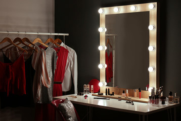 Stylish room with dressing table, mirror and wardrobe rack - Powered by Adobe