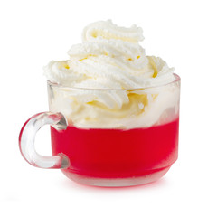 Strawberry jelly in a glass with cherries and whipped cream isolated on white background
