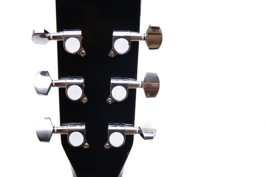 Head stock of guitar black colour and silver tuning pegs, copy space