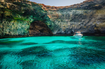Blue Lagoon, Malta - the caves of the Blue Lagoon on the island of Comino on a bright sunny summer...