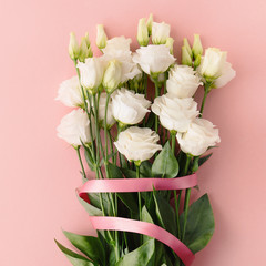 Bouquet of white roses with pink ribbon