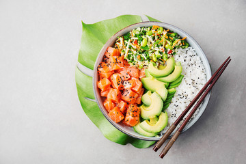 Poke bowl with salmon served in bowl