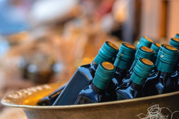 Bottles with oil in the street food market. Selective focus.