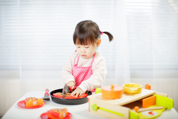toddler baby girl pretend play food preparing