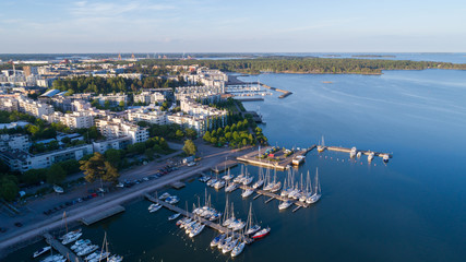 Beautiful view of harbor and boats. Helsinki city at sunset. Summer panorama.
