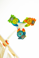 baby crib mobile on a light background bottom view