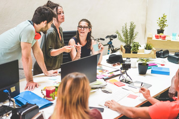 Young co-workers team talking during startup - Focus on woman with glasses face - Technology, entrepreneur, marketing  concept
