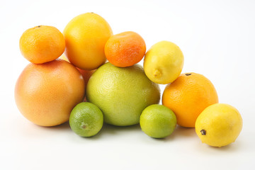 different citrus fruits on white background