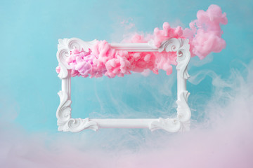 White vintage frame on pastel blue background with abstract pink cloud shapes. Minimal border composition. - Powered by Adobe