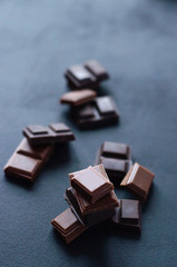 Different beautiful chocolate on a black background.