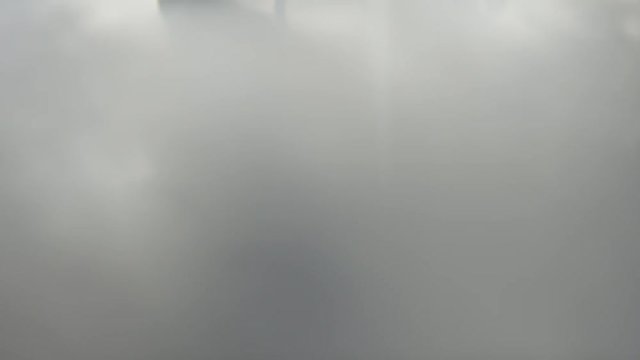 Whirling vortex mixed with creamy supstance making the picture fogy