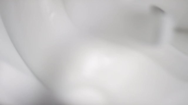 Close up of creamy supstance getting stirred