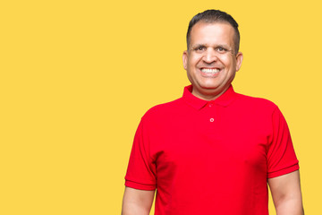 Obraz premium Middle age arab man over isolated background with a happy and cool smile on face. Lucky person.