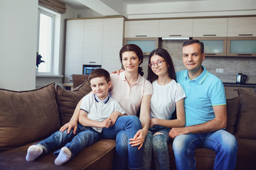 Portrait of a happy family in a room