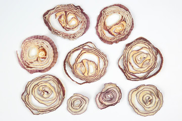 Dried salad onion slices on white background
