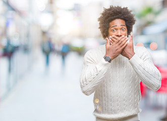 Afro american man over isolated background shocked covering mouth with hands for mistake. Secret concept.
