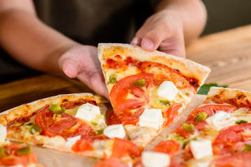 People Hands Taking Slices Of Italian Pizza. Italian Pizza and Hands