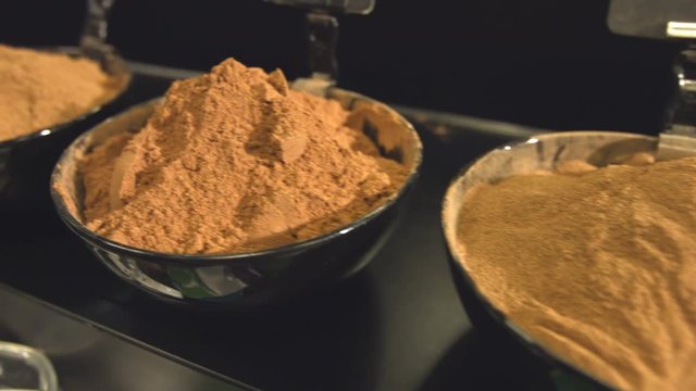 Spices in bowls.
Department with spices in the store. Ground cardamom, ground ginger, whole nutmeg, spice pepper, cumin zira, cayenne pepper, hops-suneli.