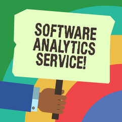 Handwriting text writing Software Analytics Service. Concept meaning Used to enhance operations and generate revenue Hu analysis Hand Holding Blank Colored Placard with Stick photo Text Space