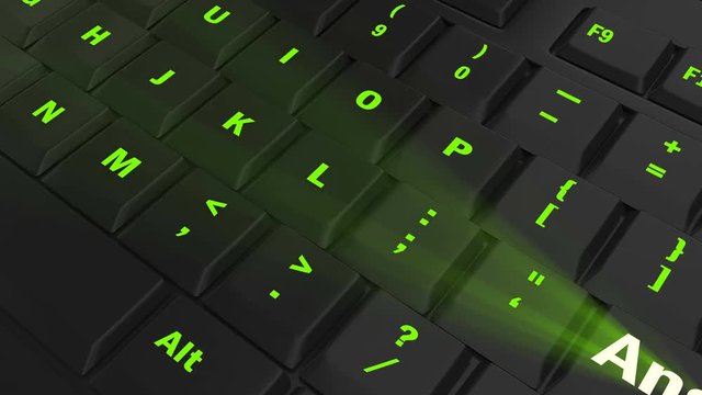 pointing the camera on green glowing Answer key on black computer keyboard