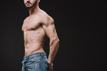 cropped view of sexy shirtless macho posing isolated on black