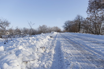 Beautiful view of empty snowy road in winter. There are no cars on the road