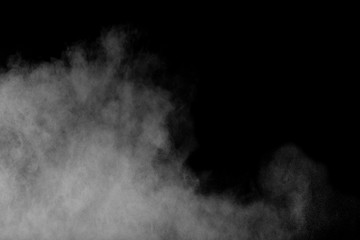 Abstract white powder explosion against black background.Abstract white dust exhale.