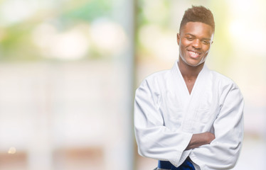 Young african american man over isolated background wearing kimono happy face smiling with crossed arms looking at the camera. Positive person.