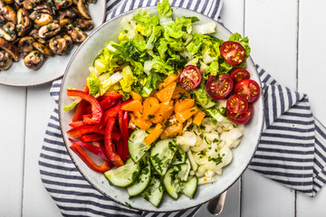 Fresh mixed salat with herbs and mushrooms