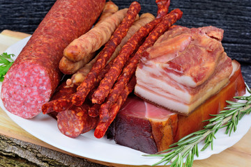 Sausages in a plate on cutting board