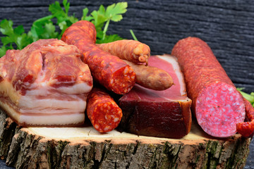 Close up of sausages and parsley on cutting board