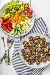 Fresh mixed salat with herbs and mushrooms