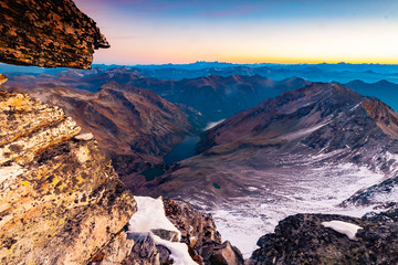 Fantastic top view from Grosser Hafner summit or peak during sunrise, Alps Austria, Hohe Tauern