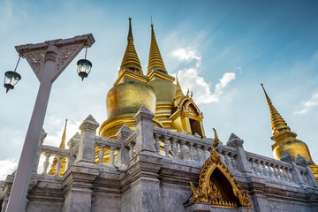 Side view of golden pagoda in thailand