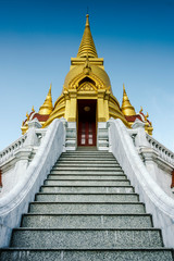 stairway to Main entrance of golden pagoda in thailand