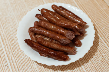 Grilled sausages on a plate.