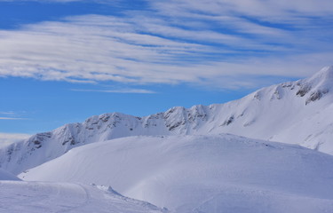 Fototapeta na wymiar Amazing Snowy landscape in the middle of the Alps. Winter in Vogel, ski center in Slovenia, Europe.