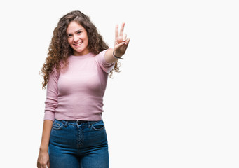 Beautiful brunette curly hair young girl wearing pink sweater over isolated background showing and pointing up with fingers number two while smiling confident and happy.