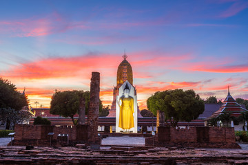 Naklejka premium Buddha statue at sunset are Buddhist temple at Wat Phra Si Rattana Mahathat also colloquially referred to as Wat Yai is a Buddhist temple It is a major tourist attractions in Phitsanulok,Thailand.