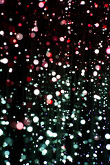 Abstract texture and background of colorful glittering bokeh lights with black background