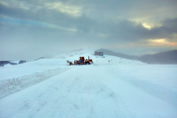 Snowblower at work in the mountains