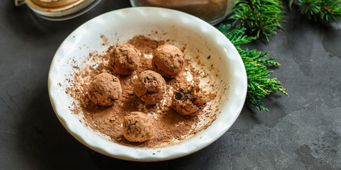 candy dressing  cocoa (dried fruit filling) sweets on a dark background. Top view. copy space