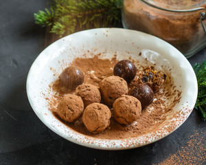 candy dressing  cocoa (dried fruit filling) sweets on a dark background. Top view. copy space