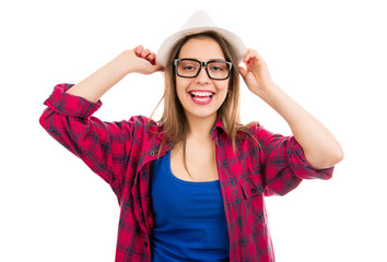 Smiling teenage woman in hat