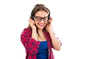 Smiling teenage woman listening to music