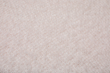 Fototapeta na wymiar pink knitted texture, top view.