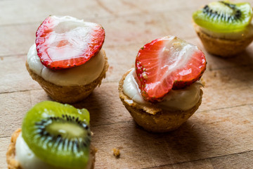 Mini Tarts, Tartolet or Tartlets with Strawberry, Cream and fresh fruits