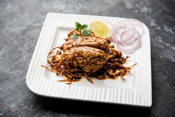 Brain / Bheja Fry of goat, sheep or lamb is a popular Indian or pakistani dish cooked on Bakra Eid(Eid-ul-zuha). served in karahi, pan or plate. selective focus
